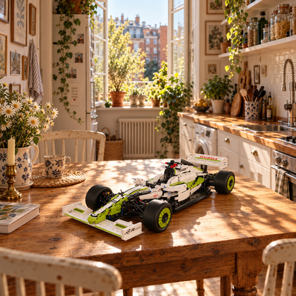 Green and white brick-built racing car displayed on a table in a sunlit kitchen