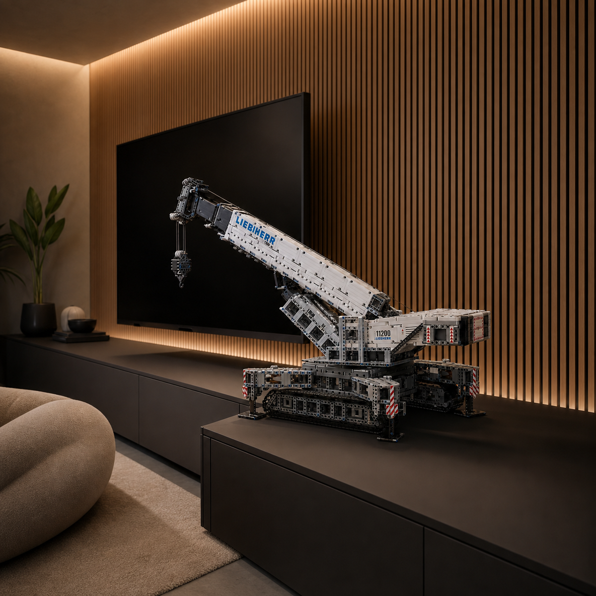 LEGO Liebherr LR 13000 Crawler Crane model displayed on a dark modern console table.