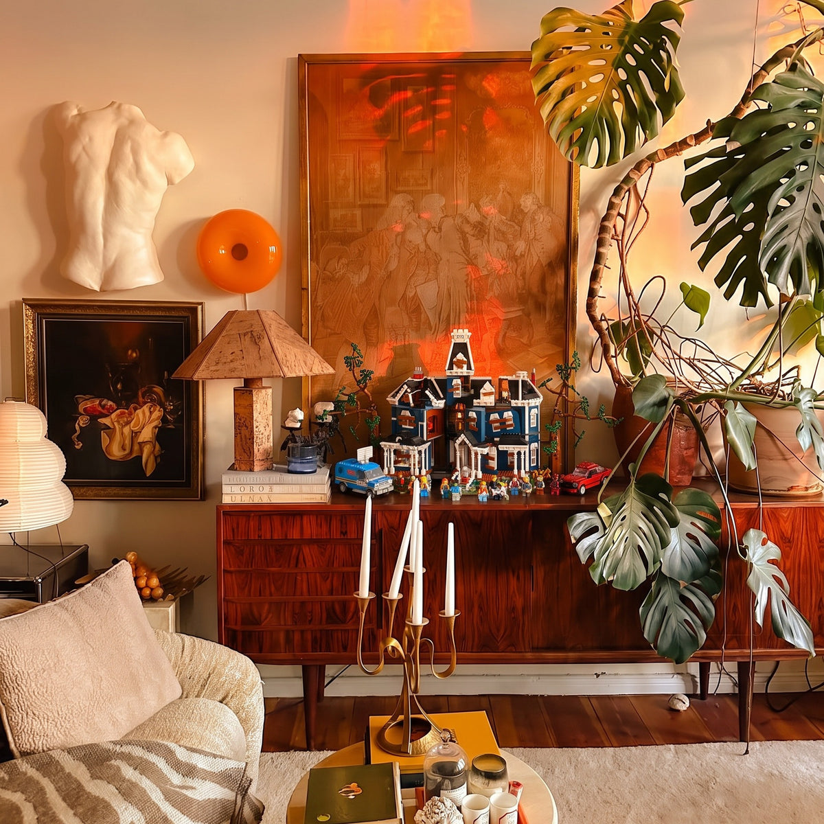Brick-built Creel House from Stranger Things on a rosewood sideboard in warm sunset light