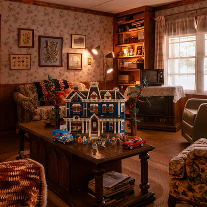 Brick-built Creel House from Stranger Things on a coffee table in a cosy 80s living room