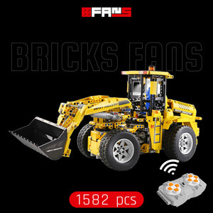 Yellow remote-controlled toy wheel loader building set with 1582 pieces.
