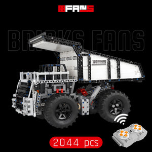 Remote controlled brick-built heavy dump truck toy with 2044 pieces and controller.
