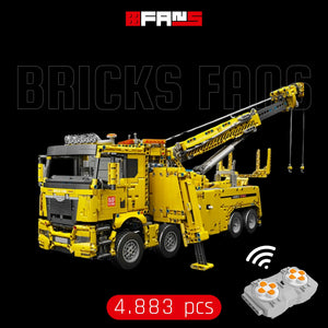 Detailed yellow brick-built mobile crane toy with remote control and 4,883 pieces.